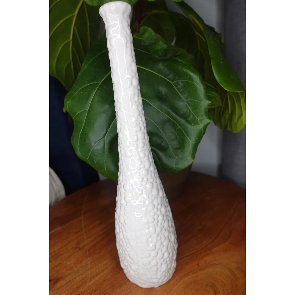 White vase with long neck and‎ gourd like ribbed textured